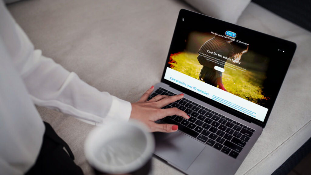 Care website seen on a laptop