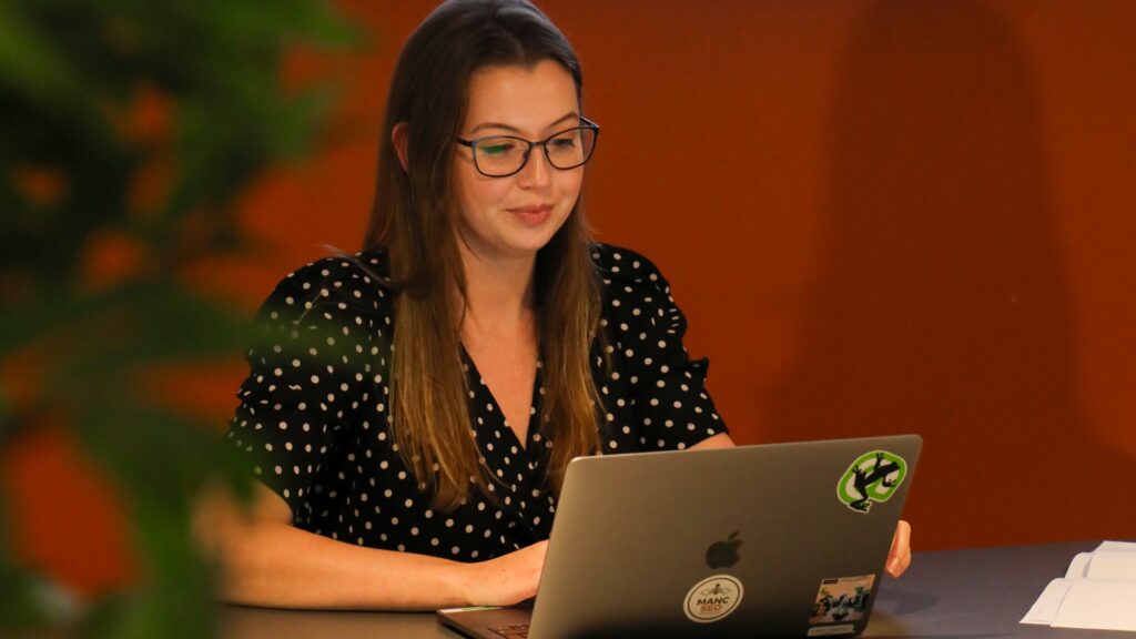 Jess working on her laptop