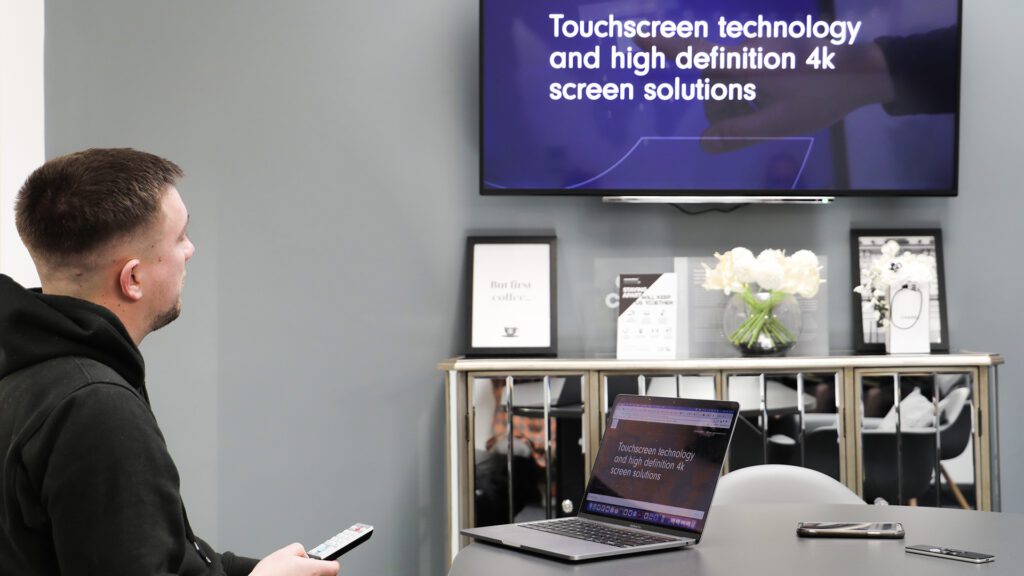 Print Room Manager, Sam, configures Innoscreen tech