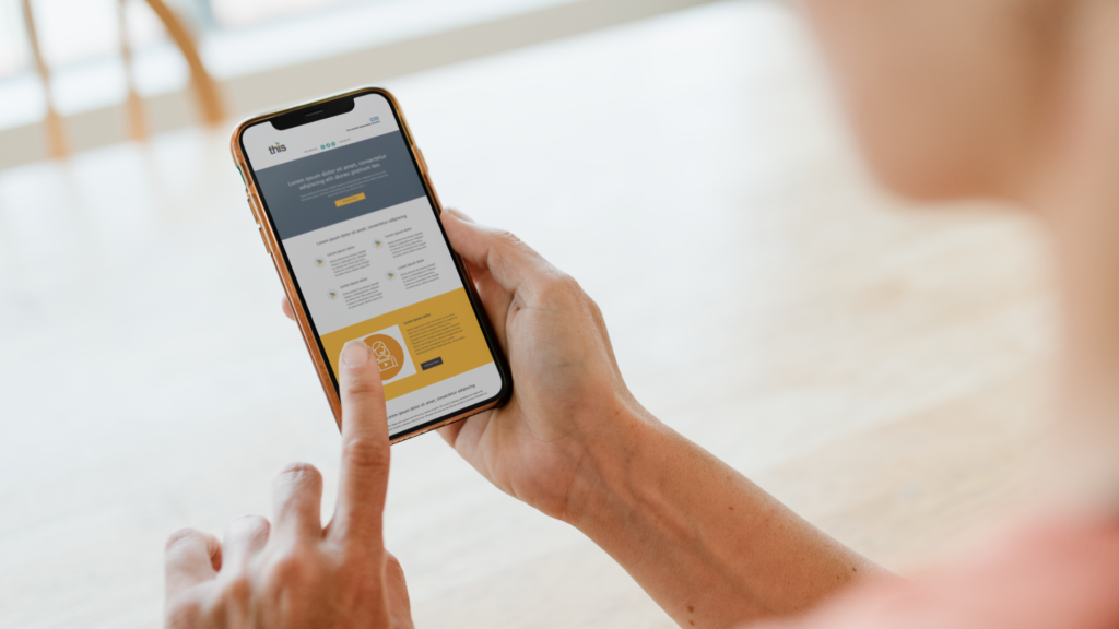 THIS website being read by user holding a mobile device