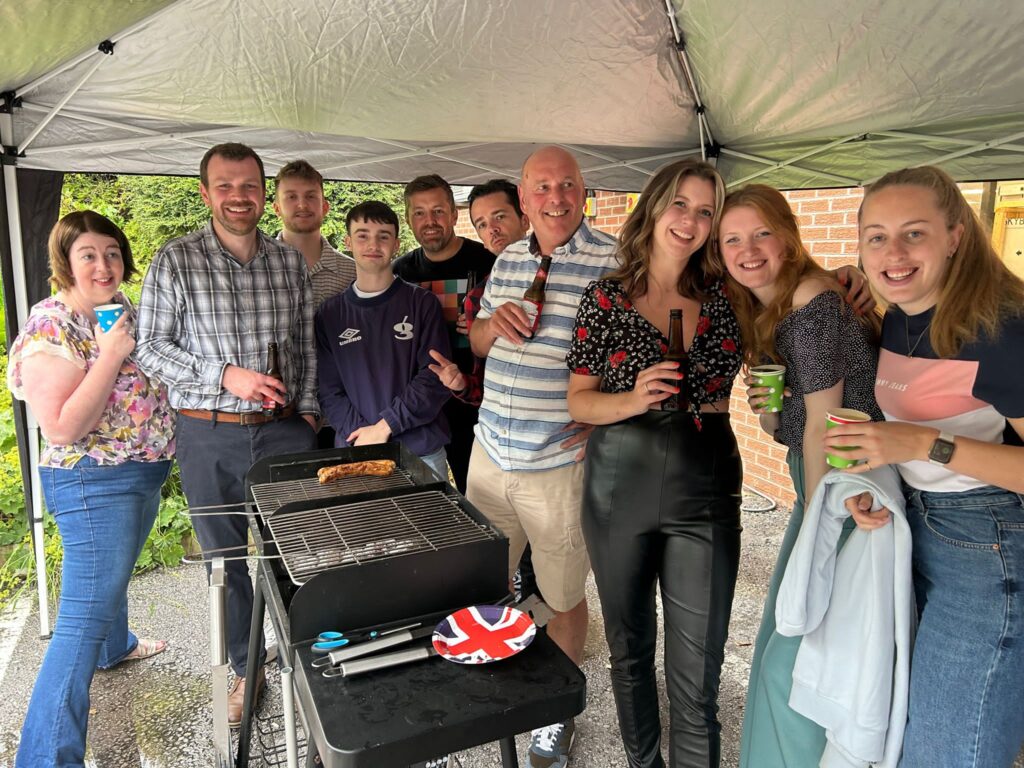 Cornerstone team gathered round a BBQ