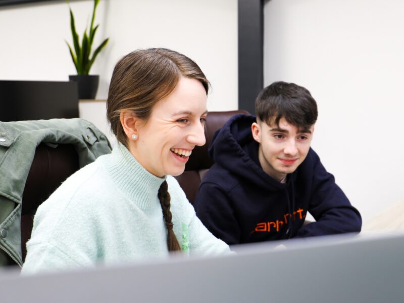 Hannah sat at her desk smiling