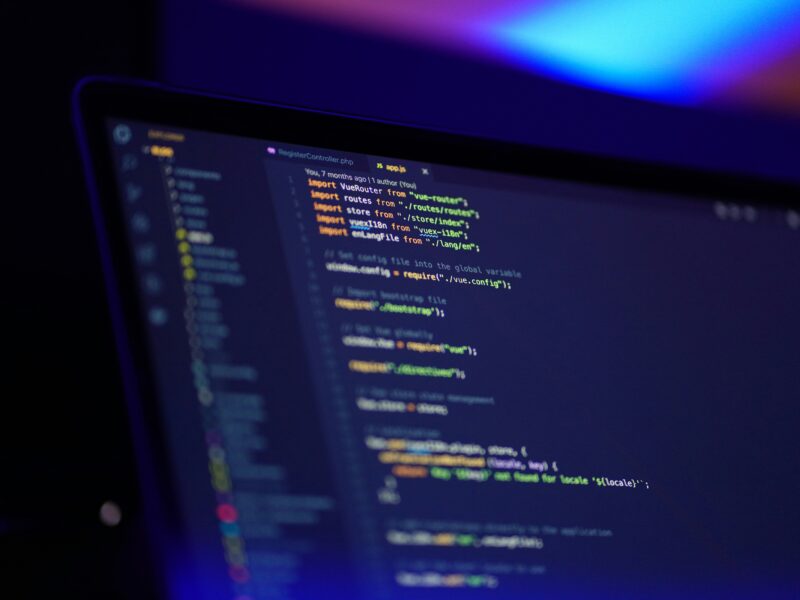 lines of php code are seen on a laptop screen
