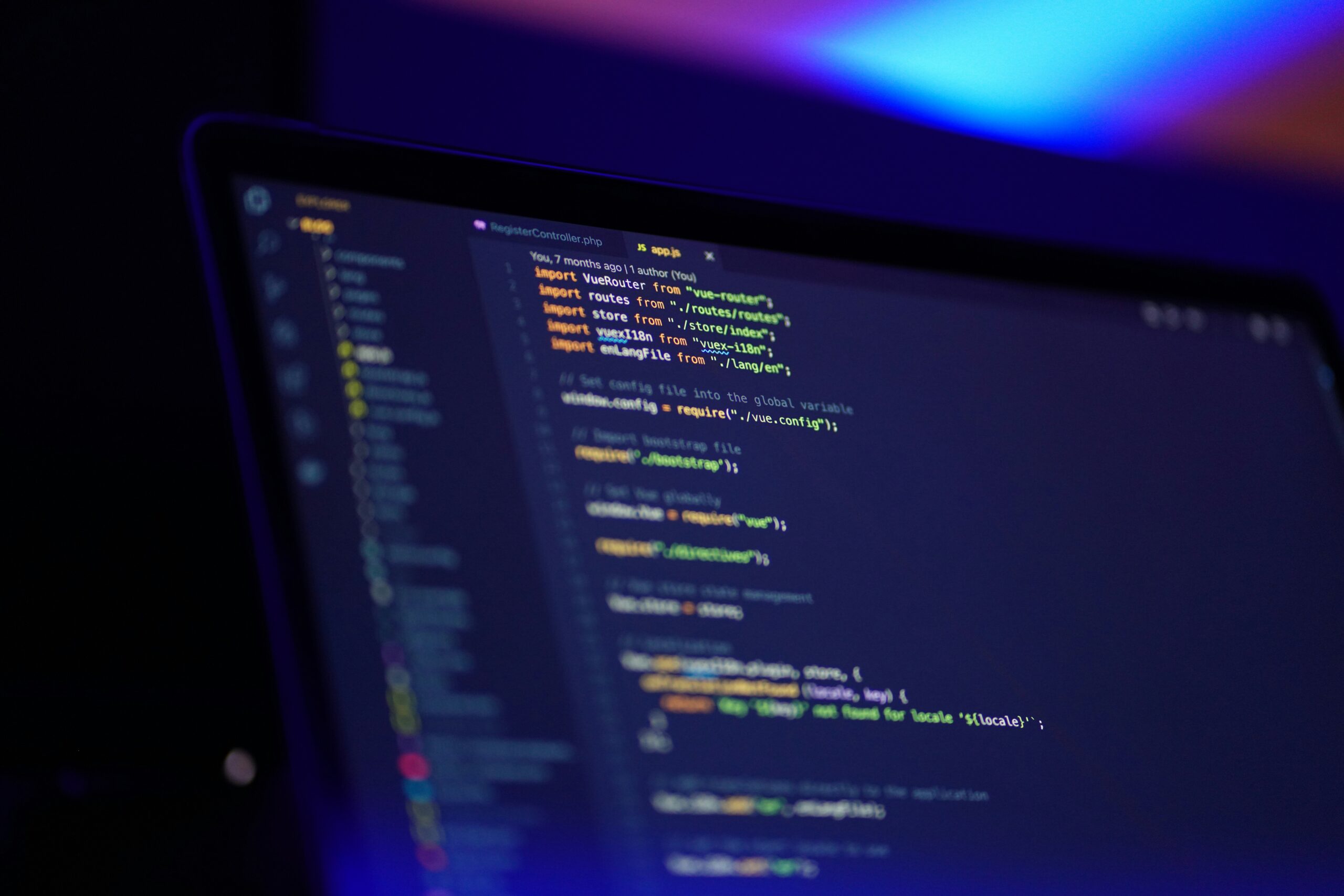 lines of php code are seen on a laptop screen