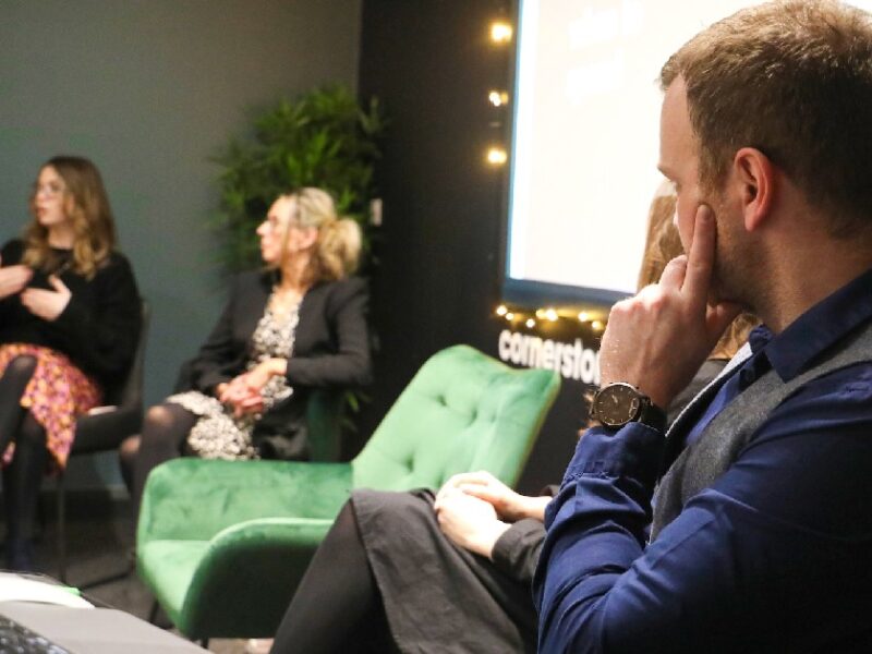 Cornerstone team sat presenting at an LFX event hosted at Cornerstone's office